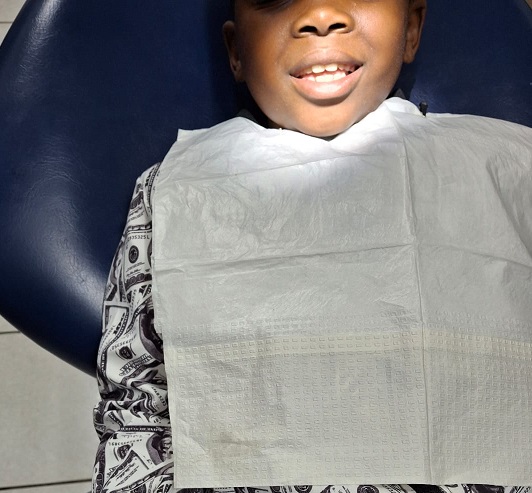 Boy smilling at the dentists office